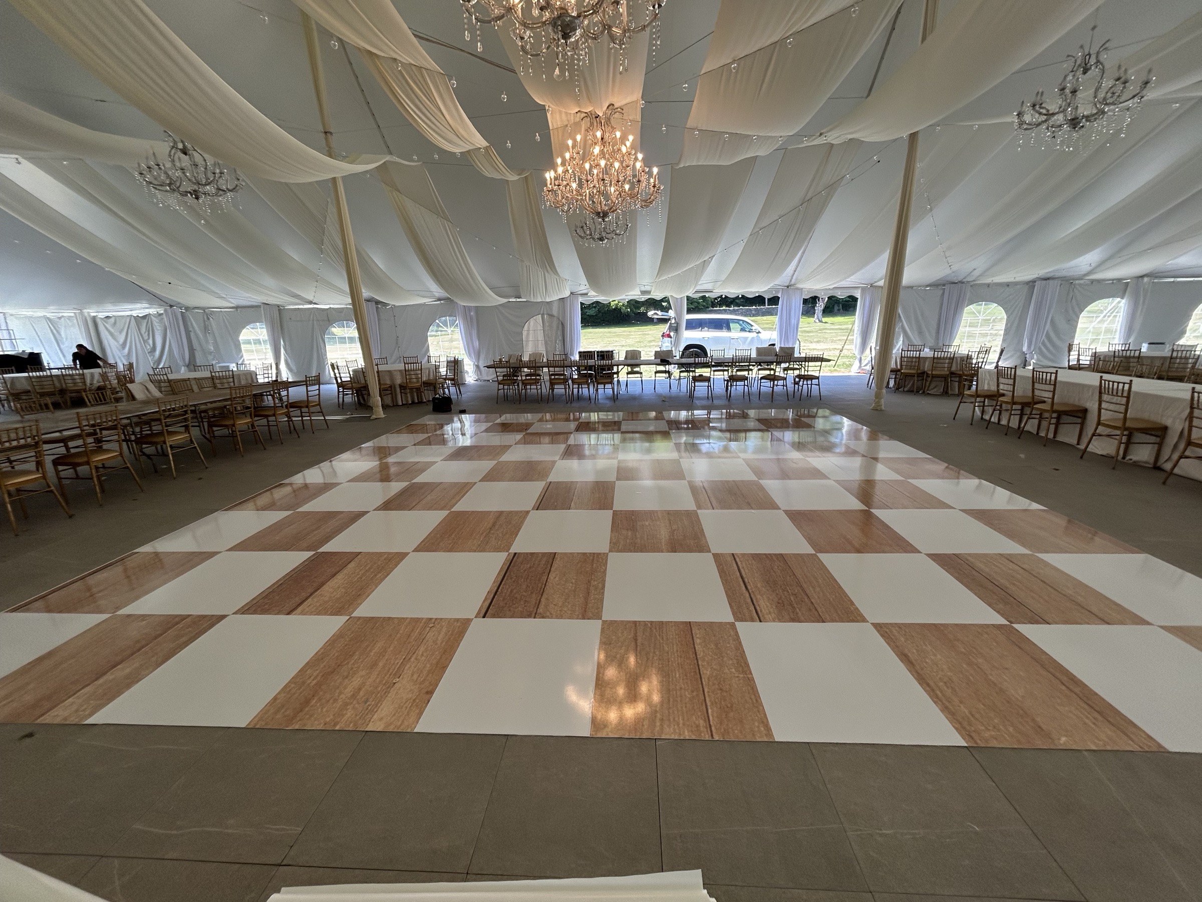 Ceiling drape and chandelier over the ballroom at The Mansion at Glen Cove
