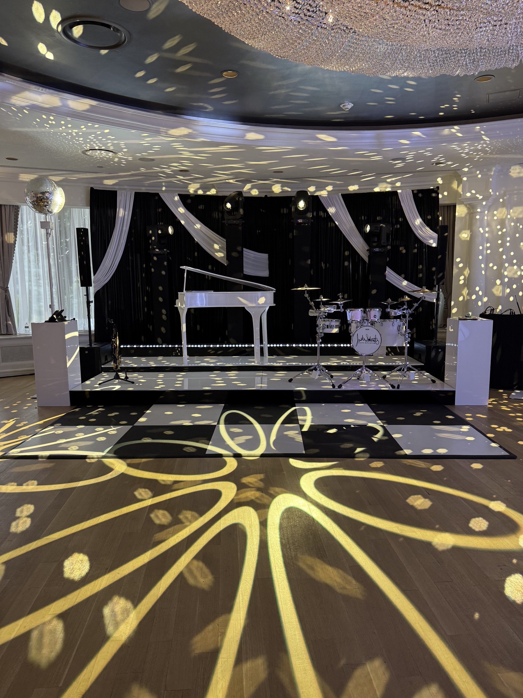 Gobo lighting patterns across the dance floor at The Mansion at Glen Cove
