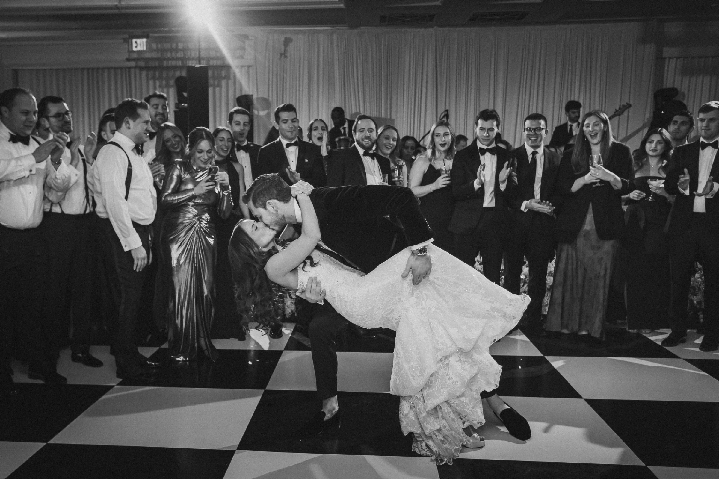 First dance dip surrounded by guests at The Lannin