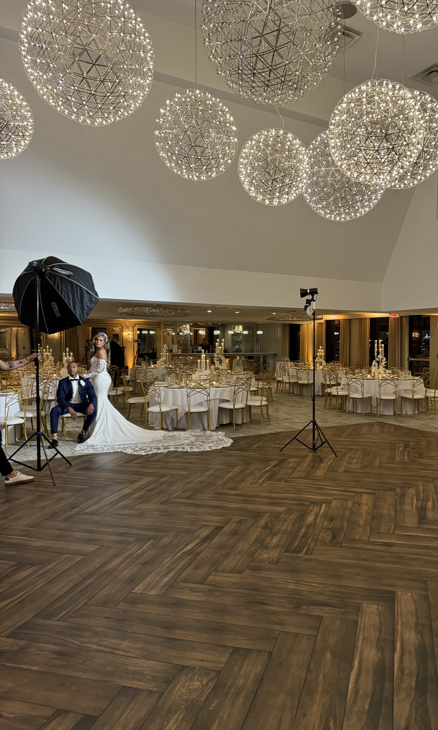 Globe chandeliers over the reception tables in the Water's Edge Summerwind Ballroom